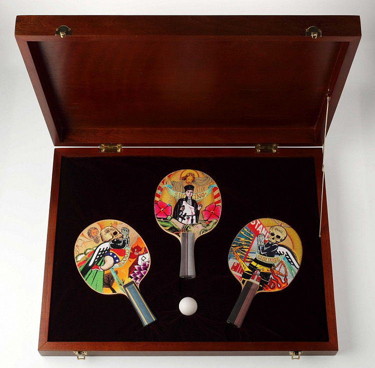 Gallery image: Bloody Trinity | 2011 | Wood box with handmade collages on three table tennis blades | 9 cm x 60 cm x 46 cm