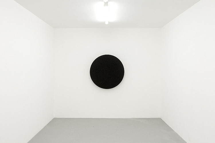Gallery image: Threnody | 2016 | The isolated vocal track of Helter Skelter (The Beatles, 1968) was reversed and given to the vocalist Zami Mdingi to sing as such, and broadcast from a circular, hyper-directional speaker visually echoing Kazimir Malevich’s Black Circle (1915) |This artwork was first exhibited on the artist’s solo exhibition, “Ecstatic Interference,” at blank projects, Cape Town, 28 January - 5 March 2016 | Photograph by Kyle Morland. 